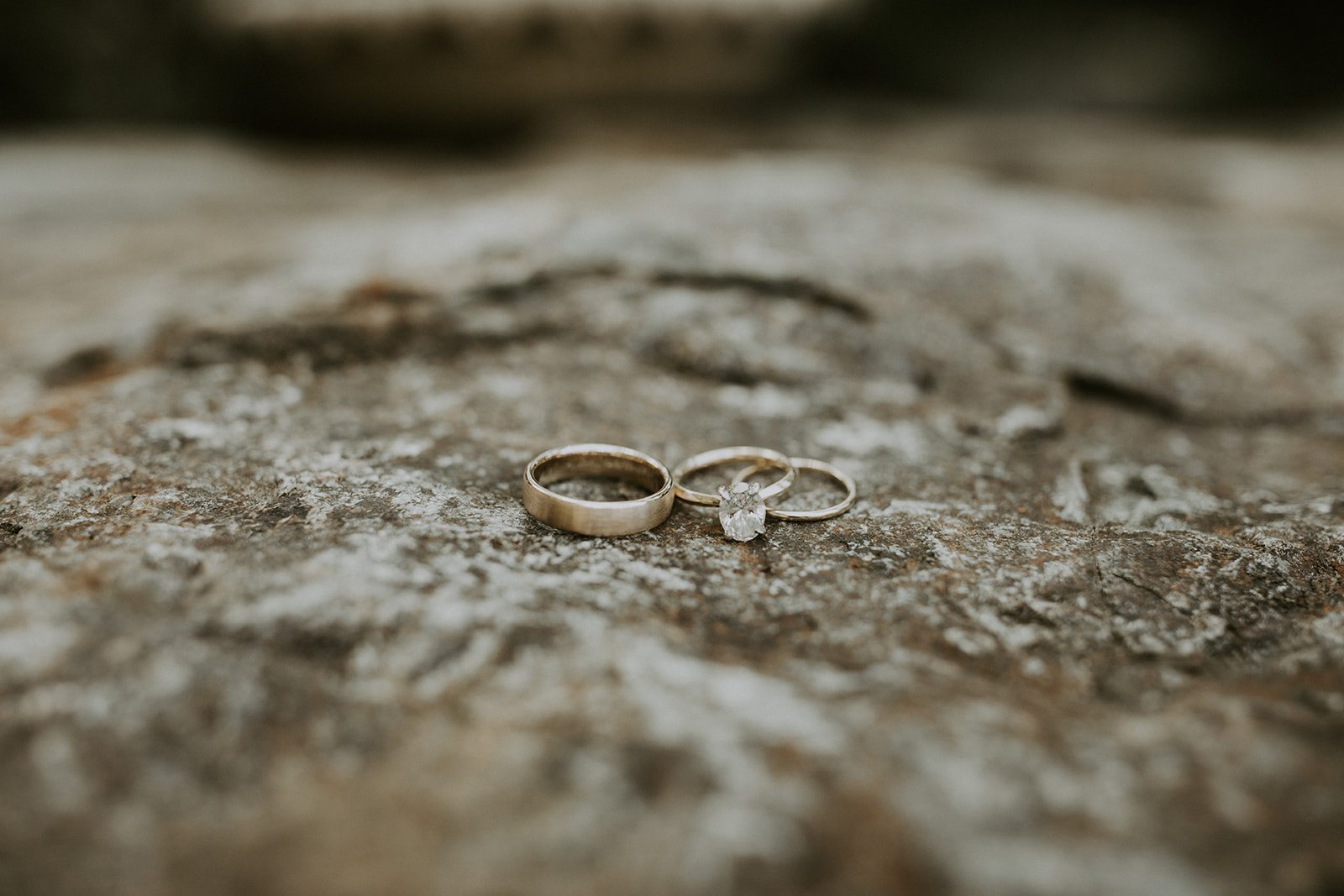 Wedding bands on a rock in nature